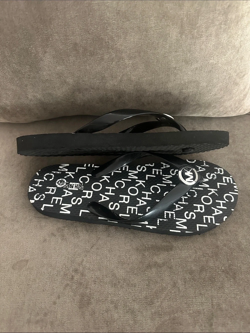 Michael Kors flip flops.  New W/O tags. Size 9